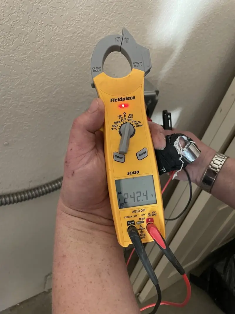 Voltage testing with clamp meter during Electrical Installation Services in Clarksville